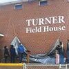 Travis Turner and family unveil the new field house lettering in memory of coach Tom Turner.  LISA MAINE PHOTO