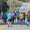 Half marathon runners race through Big Stone Gap on the first day of spring. Last year, the marathon was held virtually due to COVID-19. Runners were able to participate in person this year with some social distancing.   KED MEADE PHOTO
