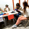 Scout Nick Sturgill performs a blood glucose check on a volunteer while Scout Koleby Bush &amp; Scoutmaster Sam Deel observe.