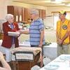 Eddie Green, center, was honored recently for his many decades of service to the Appalachia Lions Club.  KELLEY PEARSON PHOTO