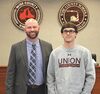 Union High School wrestler Thomas Potter was honored for his third straight state championship title at the School Board’s March 13 meeting. Potter has a title in three different weight classes and aims to secure a fourth, according to his coach Emil Schenck. Left to right are Superintendent Mike Goforth and Potter.  KENNETH CROWSON PHOTO