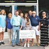 Freedom Chevrolet recently presented a $15,000 check to the town of Big Stone Gap, money raised during the second annual Jordan Barnette Townwide Birthday Bash. The funds will be used for upgrades to the Miners Park stage, which will be renamed the Jordan Barnette Memorial LOVE Stage.  KED MEADE PHOTO