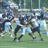 Izaak Keith (50) and Johnny Satterfield (16) team up to drop the Richlands ball carrier. PHOTO BY KELLEY PEARSON
