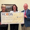 MECC President Kristen Westover and Vice President of Institutional Advancement Amy Greear receive the funds from VCEDA Executive Director/General Counsel Jonathan Belcher.  VCEDA PHOTO